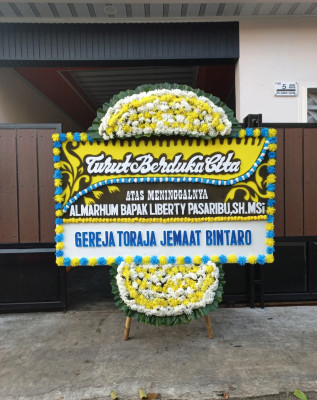 Papan Bunga Duka di Berandan Barat